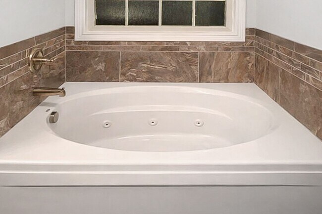 Building Photo - Pet Friendly Three Bedroom with Bonus!