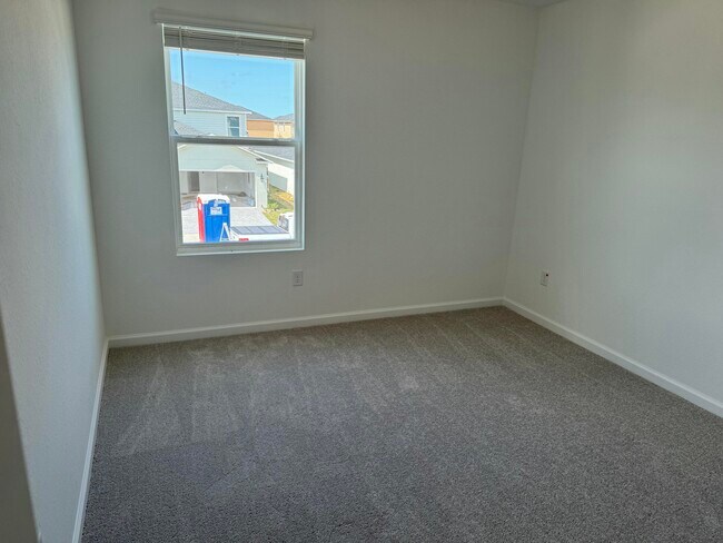 Building Photo - 10856 NW Everbreeze Dr