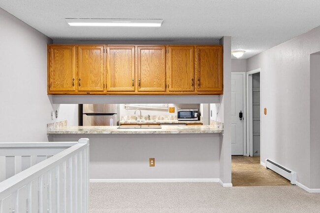 Building Photo - Students Welcome! Spacious 2-Bedroom Condo with Garage and Basement