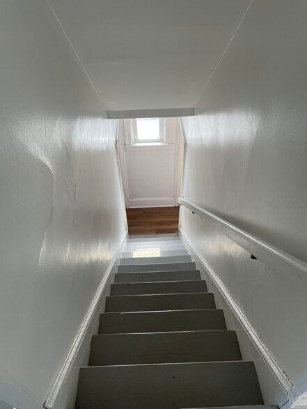 Steps to downstairs - 31 S Fayette St