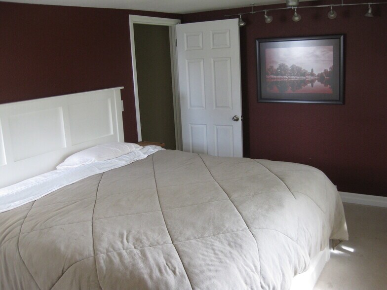 Master bedroom a half-level up from the main floor - 215 South 36th Avenue