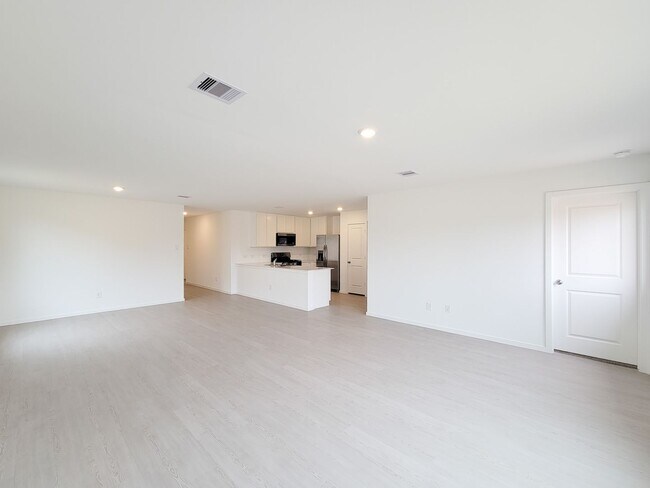 Building Photo - This great new single-story design makes smart use of the space available. At the front are all t...