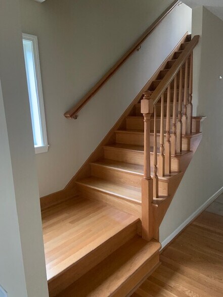 staircase to upstair bedrooms baths and laundry room - 7117 Beach Dr SW