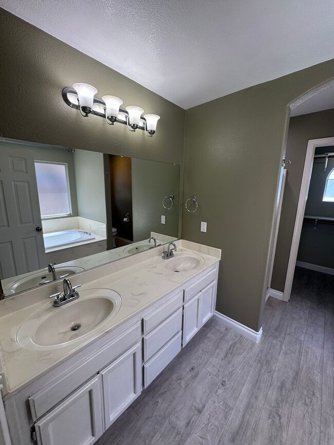 Building Photo - 4-Bedroom Home with Updated Kitchen and Co...