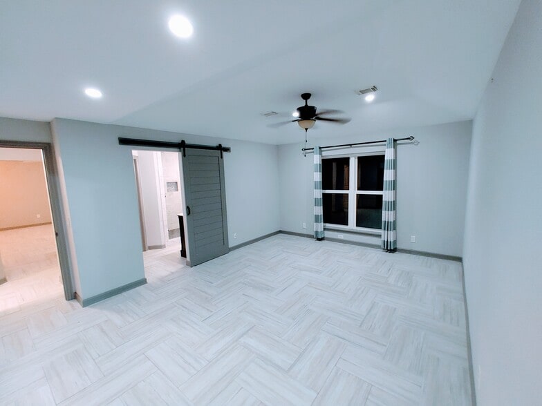 Main bedroom has vaulted ceilings and barn door entry to bathroom - 2 Arnica Ct