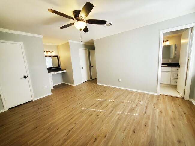 2nd Primary bedroom with built in desk/vanity area, two walk-in closets, and en suite bathroom. - 37438 Meadowview Dr