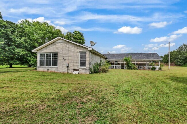 Building Photo - spacious 4-bedroom, 2.5-bath home featuring a 2-car garage and fresh updates throughout.