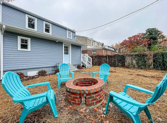 Fenced backyard with fire pit near off Street parking. - 309 E Brookland Park Blvd