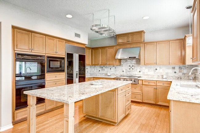 Lavish Subzero fridge, s/s fan & range - 18551 Amalia Ln