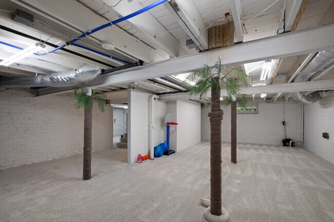 Basement with carpeting and full perimeter sump pump.. - 31 Dartford Ave