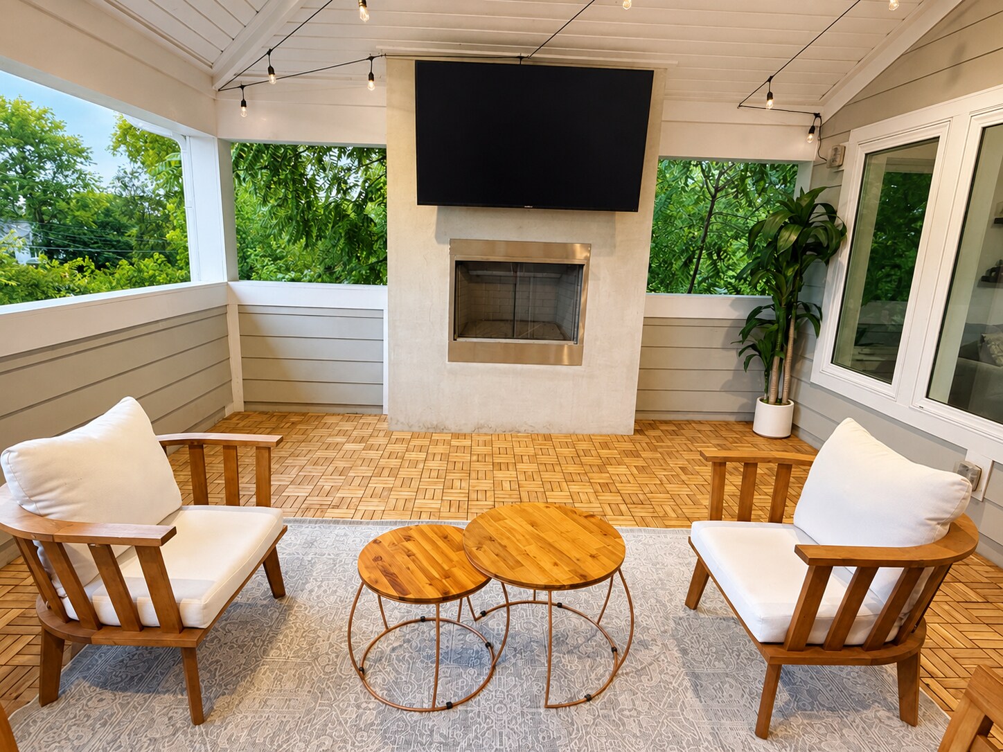 Covered Outdoor Lounge: Relax in a private covered retreat featuring comfortable seating, a cozy - 916B N 6th St