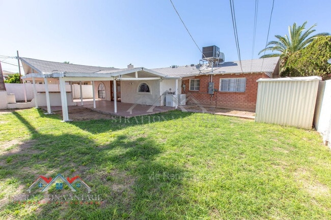 Building Photo - 8119 E Amelia Ave