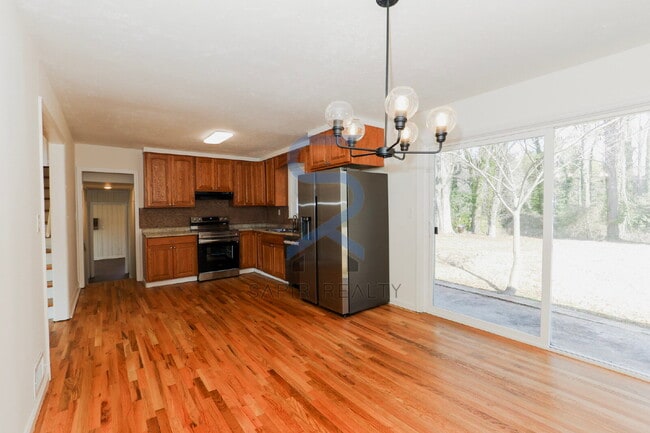 Building Photo - Move in before February 28th and choose your reward: a $250 Amazon Gift Card or a 55" Smart TV!