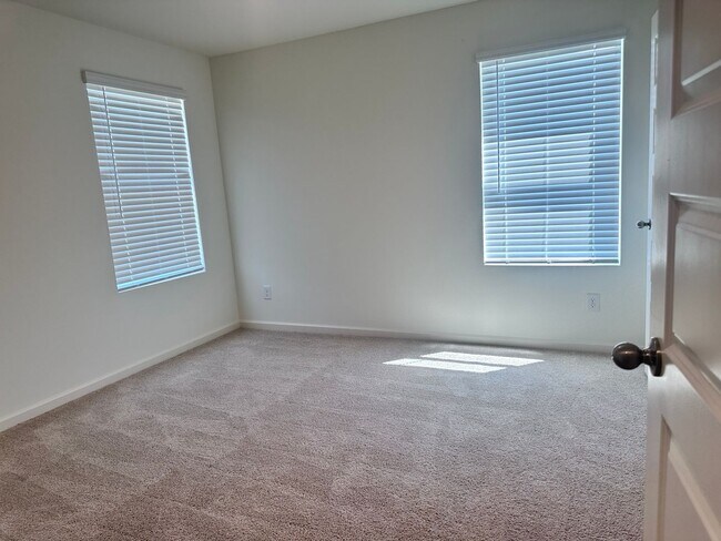 Building Photo - efficient two-level home provides a large living room, 4 very spacious bedrooms, and 2.5 bathrooms