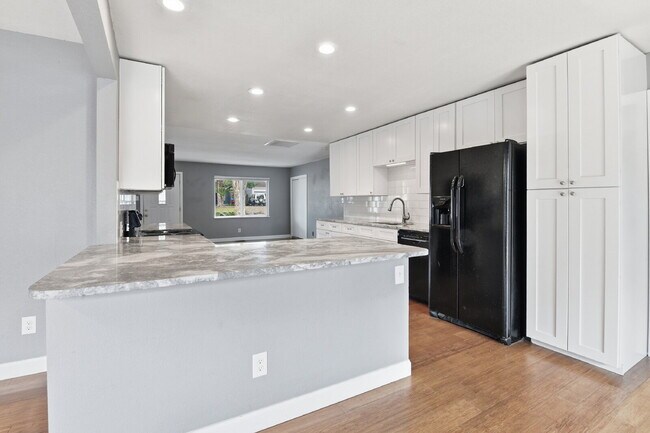 Building Photo - $3,045.95, 3 bed, 2 bath house in Denver with Fenced in Yard and In Unit Laundry!