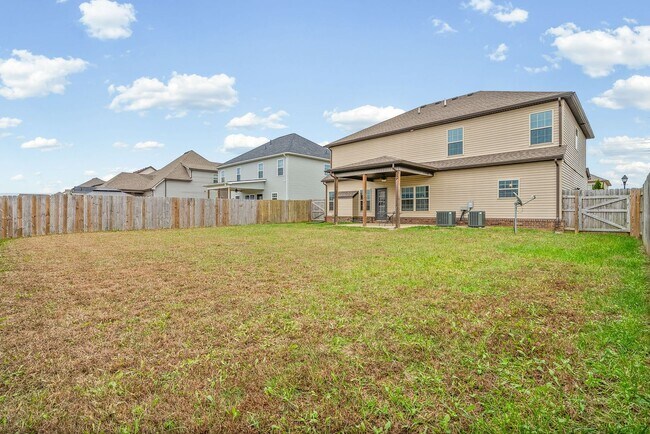 Building Photo - Four Bedroom with Three Car Garage!