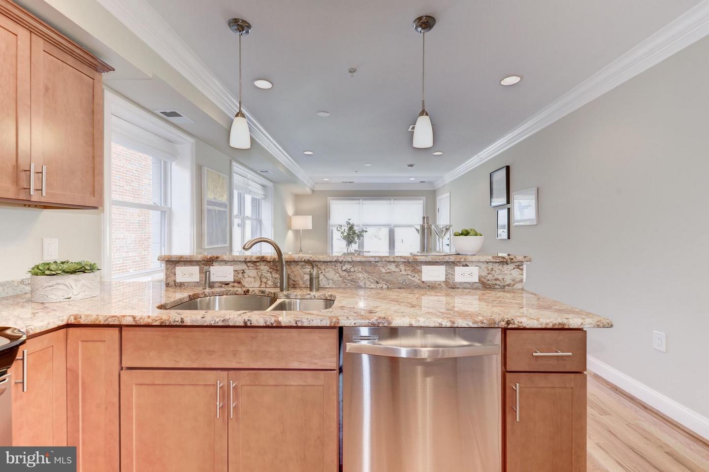 Kitchen island with pendant lighting - 5511 Colorado Ave NW
