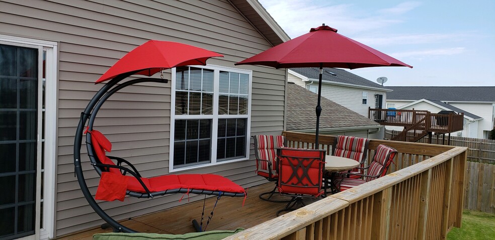 Deck was extended to span the length of the house 20"x24". Stairs lead to an open back yard. - 3916 Bluebell Dr.