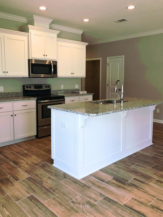 Building Photo - 3/2 with landscaping included!