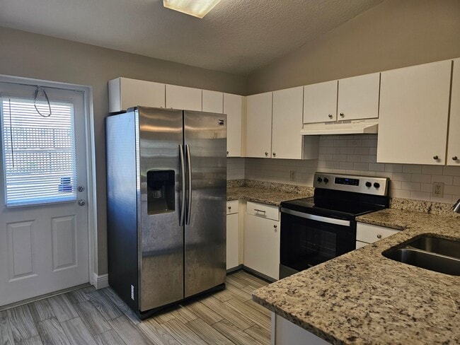 Building Photo - Charming 2-Bedroom, 2-Bath Condo with Priv...