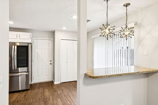 Building Photo - Welcome to this beautifully remodeled sing...