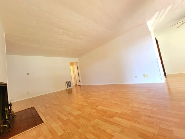 View of LIVING room towards bedrooms, bathroom, bonus room & backyard - 12051 Alberta Dr