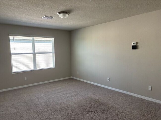 Building Photo - Like-New 4 Bedroom 3 Bath with Pond View & Two Living Spaces — Minutes to South Lake Nona