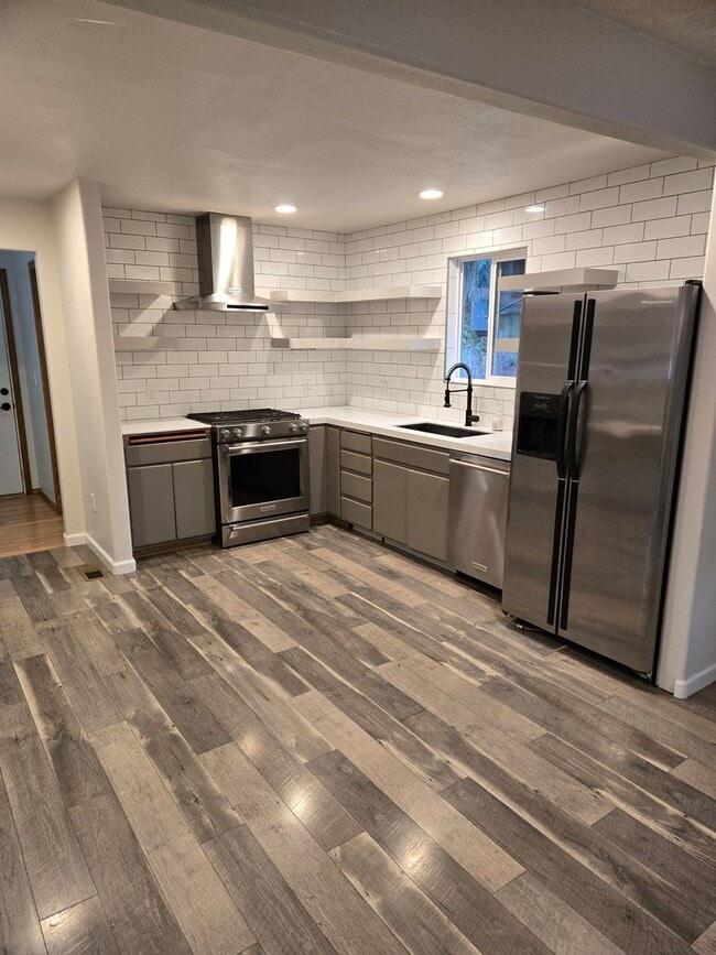 Building Photo - Large lot with tons of storage !  3 br , 2 bth + office+ 2  Car-garage + 2 Wooden Sheds