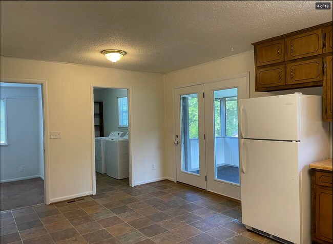 Convenient laundry room and pantry and steps away from your outdoor space - 714 Woodland Dr S