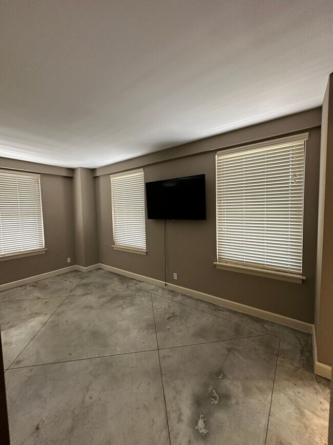 Building Photo - INCLUDES GARAGE PARKING AND INDOOR POOL! 1...
