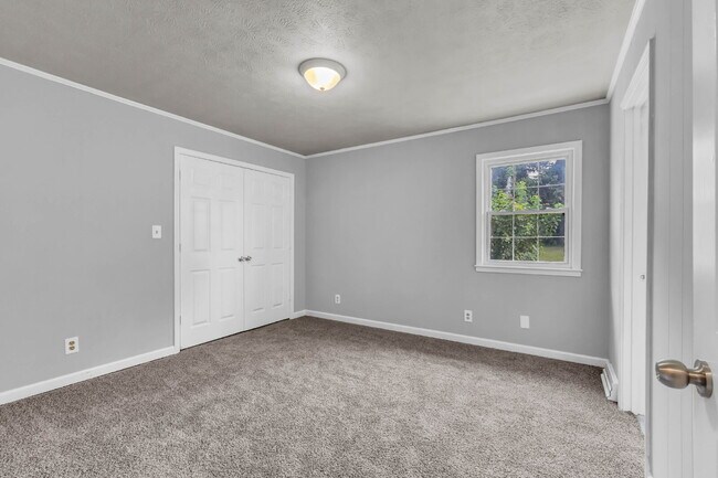 Building Photo - spacious 4-bedroom, 2.5-bath home featuring a 2-car garage and fresh updates throughout.