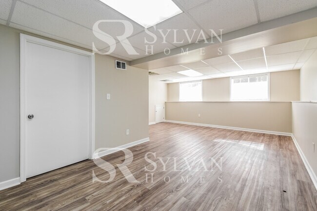 Building Photo - The living is easy in this 4 bedroom, 2 ba...