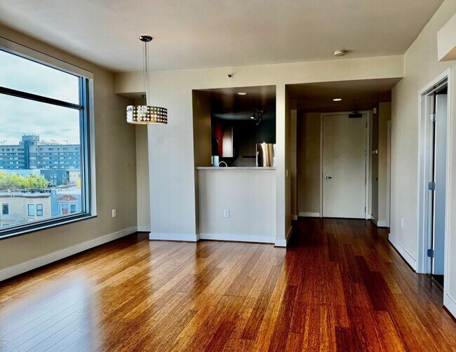 Building Photo - Corner Light. City Energy. Zero Compromise.