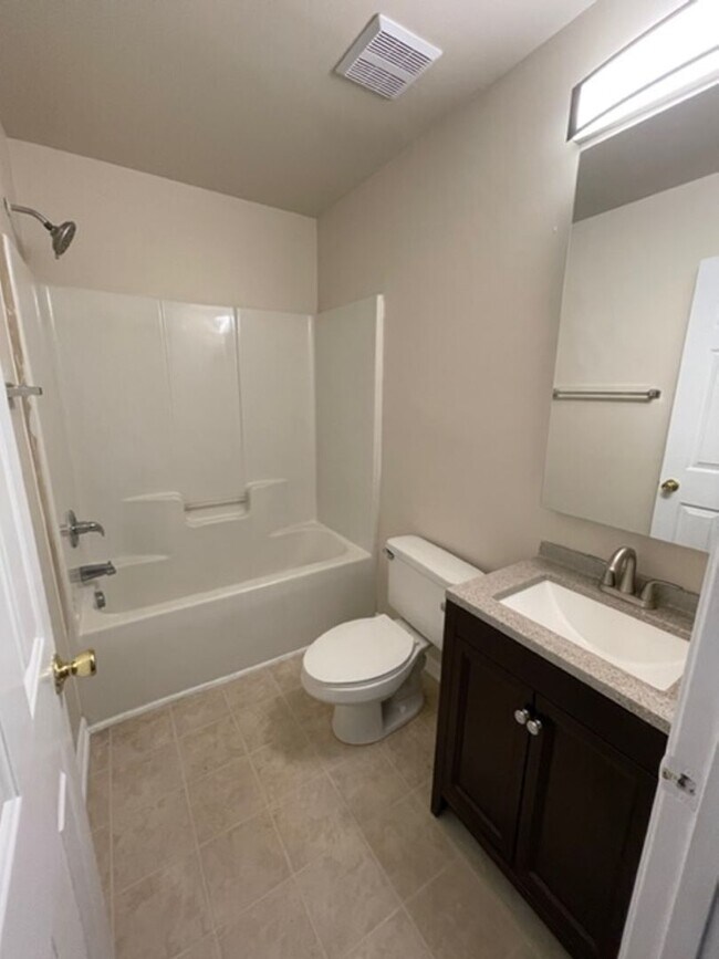 Building Photo - Must see this 4 bedroom 2.5 bath townhouse with 1 car garage .