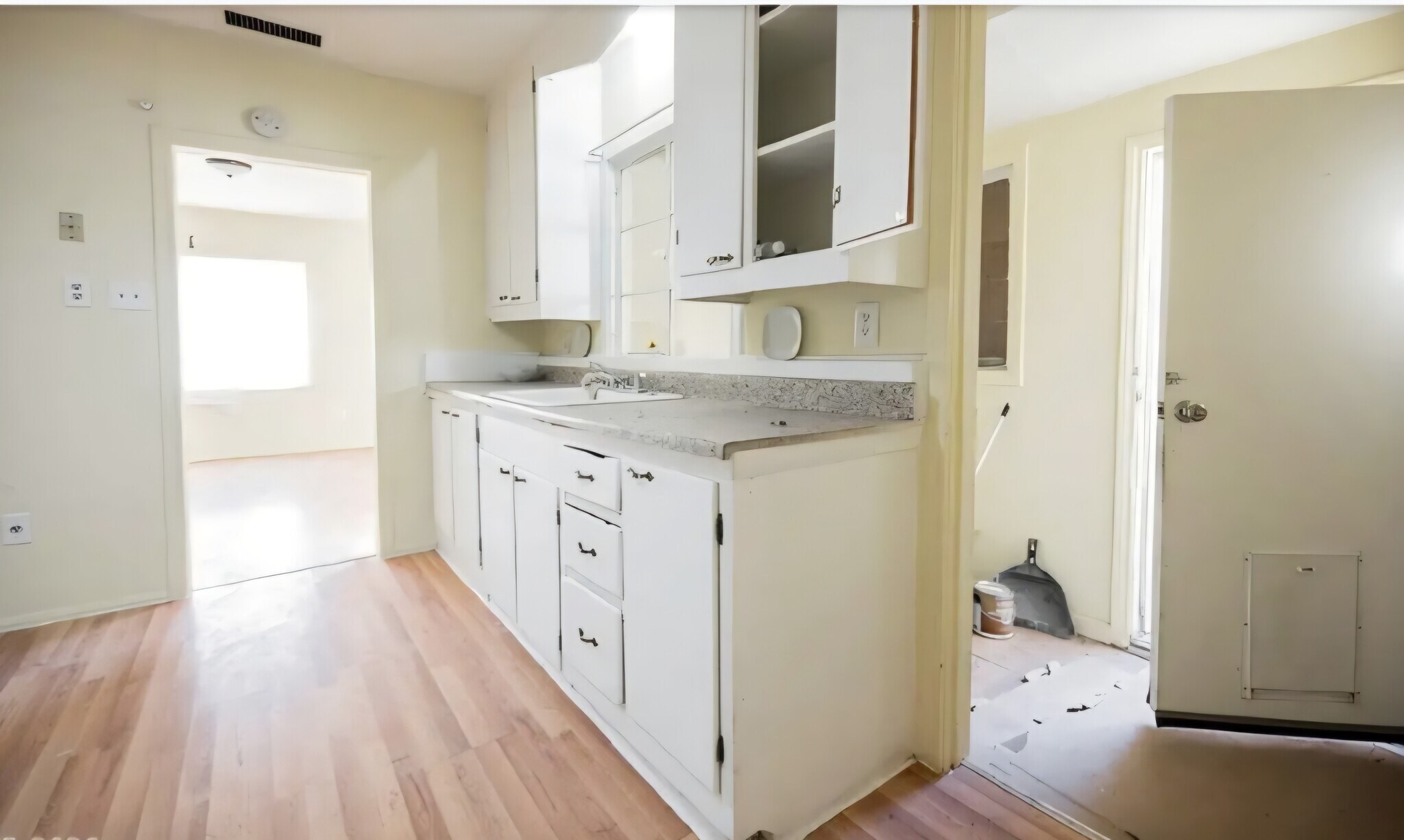 Kitchen and side exterior exit with doggie door - 203 N 13th St