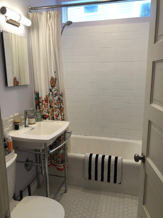 Bathroom has new tile on the floor and tub surround. - 3022 Columbus Ave.