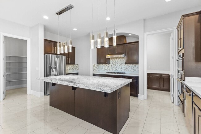 Building Photo - Canyon Falls Single-Story: Chef’s Kitchen, Office + Built-In BBQ Yard (3-Car)