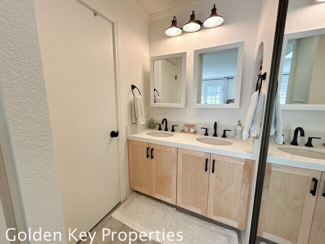 Building Photo - Welcome to this stunning ***unfurnished*** tri-level condo in the desirable Casitas de la Costa c...