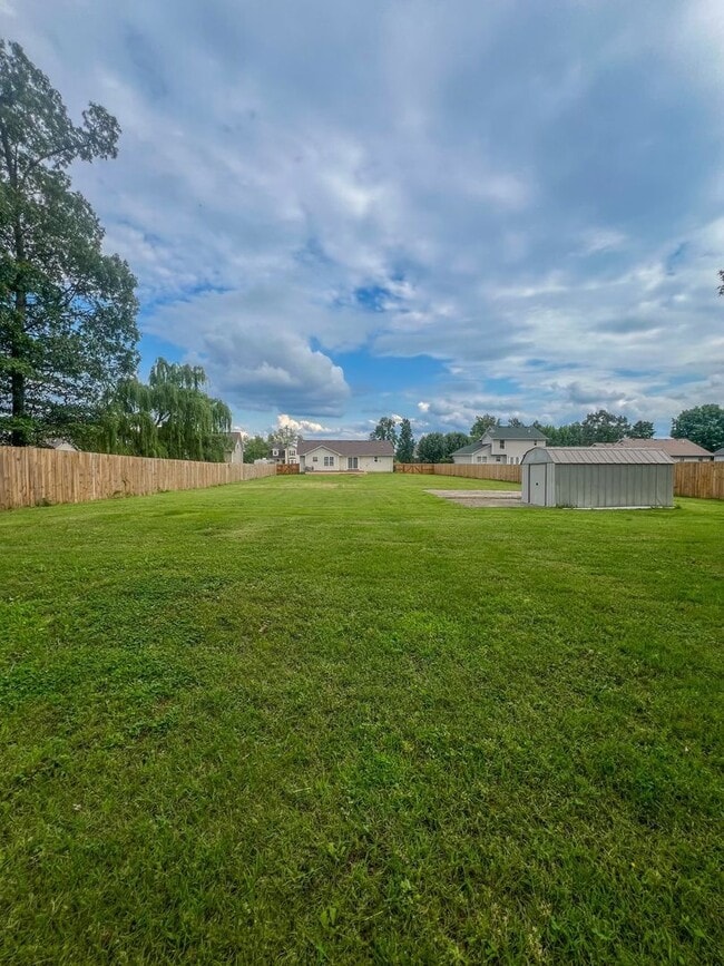 Building Photo - Massive Fenced Backyard with a Shed and Ga...