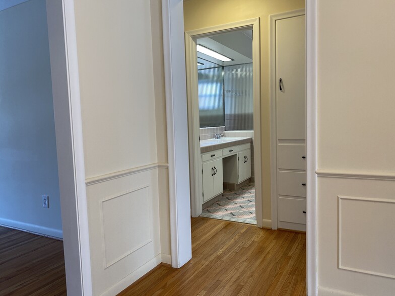 Hallway with built-in linen closet - 4011 Hillandale Rd