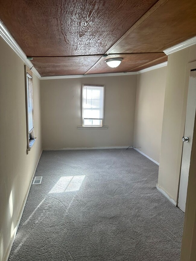 Building Photo - Four-Bedroom Bungalow with Fenced Yard Nea...