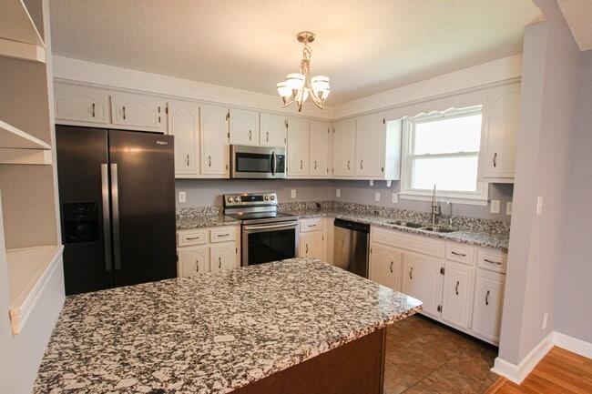 Building Photo - Pet Friendly Three Bedroom with Basement!