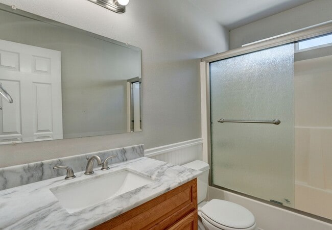 Building Photo - Spacious 4-Bedroom Home with Cozy Backyard...