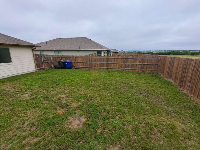 Building Photo - "Charming 3-Bedroom Home with Elegant Gran...