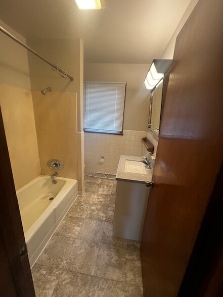New floor and vanity in bathroom. - 607 Hood St