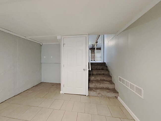 Building Photo - Spacious 4BR Home with Finished Basement, Fireplace & Unique Layout