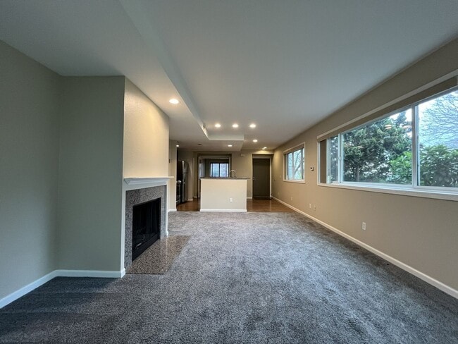 Building Photo - Ground Floor End Unit on Jantzen Beach with River Views & Flexible Living Space