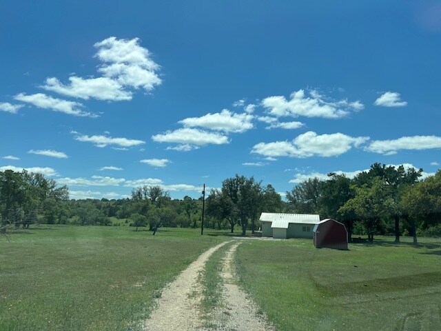 Road leading to house. There is no longer a barn. - 9900 E State Highway 71