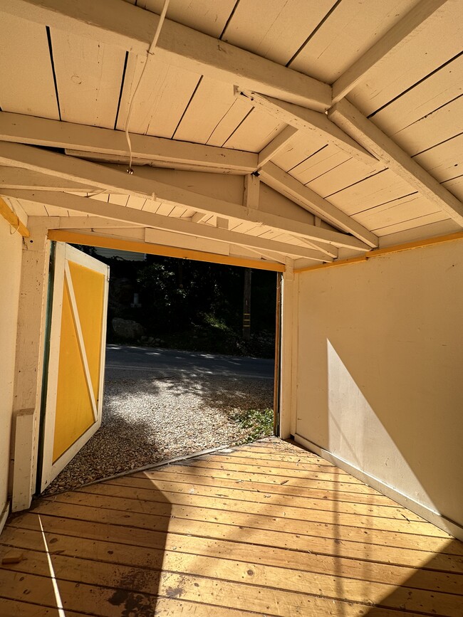 Looking out at street from inside garage studio, doorknob door to the left - 19876 Observation Dr