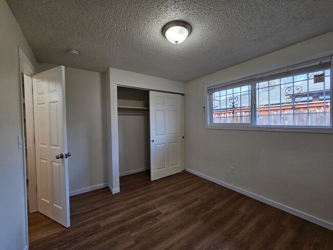 Building Photo - Charming Single-Level Home Featuring New Hardwood Floors, Bright Bedrooms & Open-Concept Living